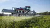 Aerial view of the ARTEC F40 EVO self-propelled sprayer at work in a rapeseed field